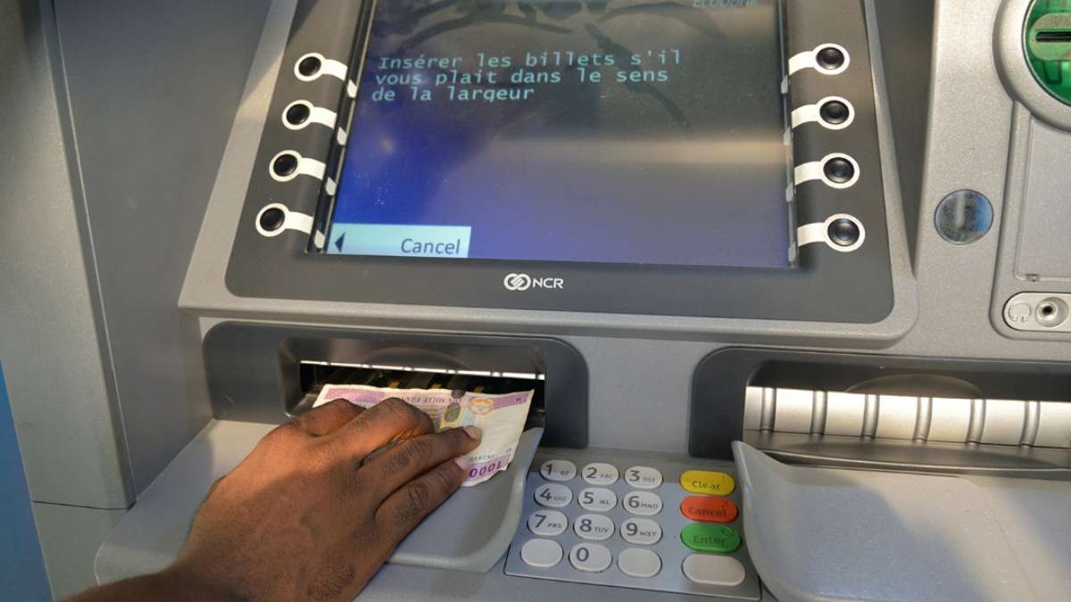 Person Withdrawing cash from an  ATM in Cameroon